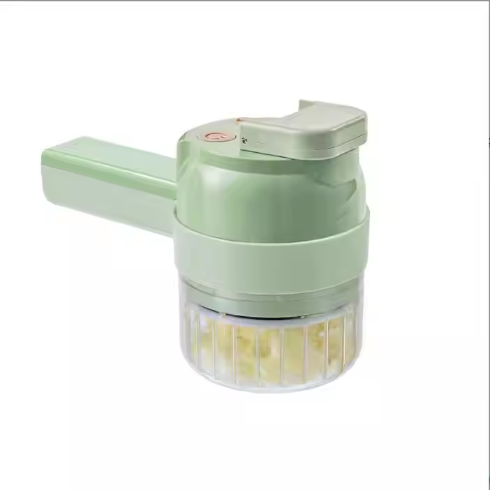A light green electric garlic press with a clear container showing chopped garlic inside, set against a plain white background.