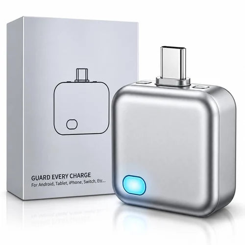 A silver USB-C to multi-port adapter shown next to its white packaging box. The adapter has a metallic finish, a glowing blue indicator light, and a USB-C connector on top, with the box displaying the text 'GUARD EVERY CHARGE'.
